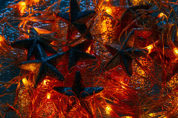 Abstract dark magic Christmas background with garland and stars