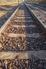 view of the rails from a low perspective, close-up of the rails and railway sleepers.