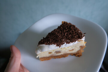 Creamy cheesecake with chocolate on a plate