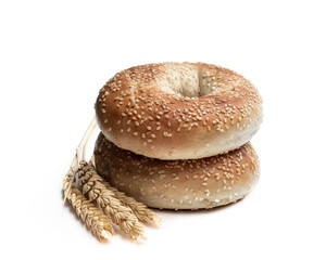 Stack of sesame seed bagels isolated on white background