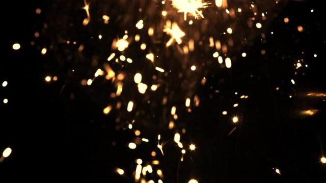 Bright lights of New Year's fireworks on a black background. Filmed is slow motion 1000 frames per second.High quality FullHD footage