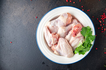 raw chicken wings meat poultry fresh meal snack on the table copy space food background rustic. top view keto or paleo diet