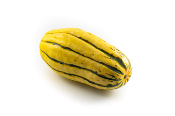 Close up photo of a delicata winter squash with green striping