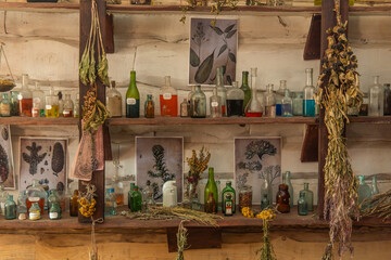 shelf of bottles with vintage medicines in a pharmacist store