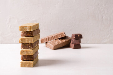 A stack of healthy food bars. Fruit nut bars for a healthy snack and breakfast, selective focus.