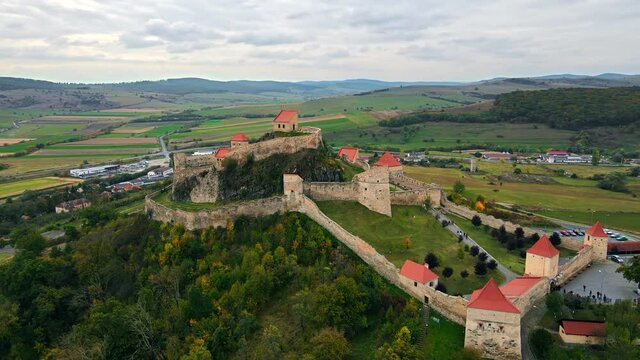 Aerial drone view of Rupea Fortress, Romania. Citadel located on a cliff, tourists