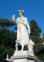 Goddess of abundance statue in Piazza del Popolo, Rome, Italy, 2021.