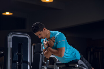 young man exercising spinals on a stretcher