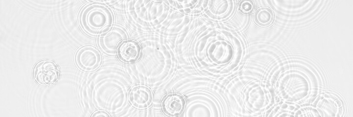 Water background. White transparent water texture, blue mint water surface with rings and ripple....