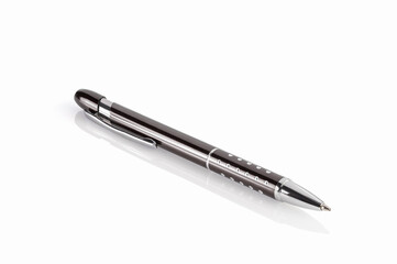 Side view of a ballpoint pen, isolated on a white background. Close-up. Full depth of field.