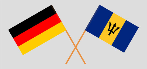 Crossed flags of Germany and Barbados. Official colors. Correct proportion