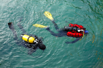 Scuba divers workers underwater archaeology works. Lake underwater archaeological survey works in...