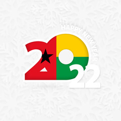 Happy New Year 2022 for Guinea-Bissau on snowflake background.