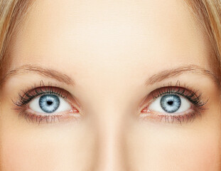 female  blue eyes with makeup and long eyelashes