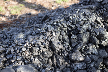 A pile of coal on the lawn. Eco-friendly fuel for residential buildings and fireplaces