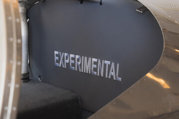 Experimental label on small aircraft inside 747-8F