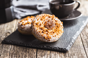 Sweet glazed donut with sprinkles.