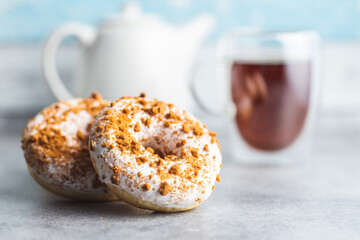 Sweet glazed donut with sprinkles.
