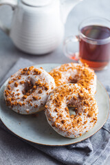 Sweet glazed donut with sprinkles.