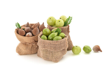 Terminalia bellirica, Terminalia chebula and Phyllanthus emblica fruits in sack isolated on white background with clipping path.