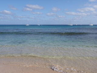 Sandy beach and boats on Atlantic Ocean at Sal island, Cape Verde