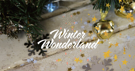 Image of winter wonderland text over christmas decorations