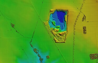 Digital elevation model. GIS 3D illustration made after proccesing aerial pictures taken from a drone. It shows an opencast mine excavation on a huge flat surface