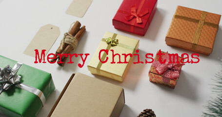 Image of merry christmas text over presents