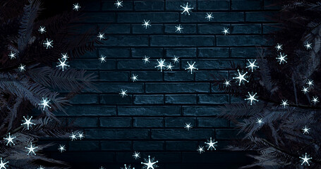 Image of snow falling at christmas over fir trees