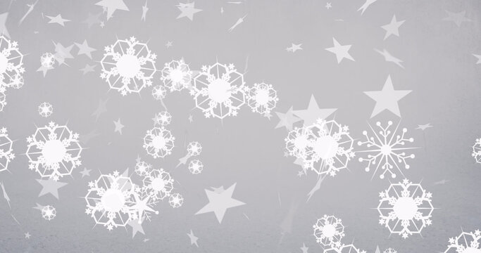 Image of snow falling and stars at christmas on white background