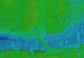 Digital elevation model. GIS 3D illustration made after proccesing aerial pictures taken from a drone. It shows the area of the city with tight buildings with a road viaduct passing over the valley
