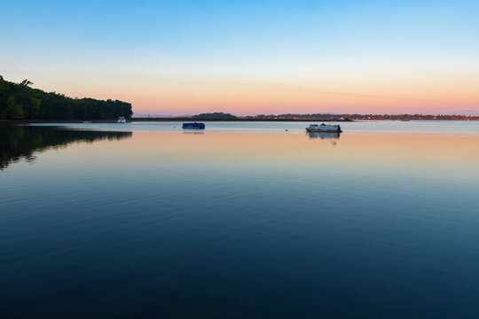 dawn illuminates lake champlain in saint albans bay vermont