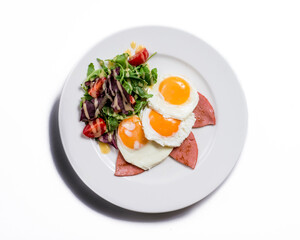 fried eggs with tomato and basil