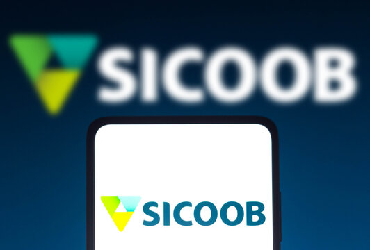 November 11, 2021, Brazil. In this photo illustration the Sistema de Cooperativas de Crédito (Sicoob) logo seen displayed on a smartphone screen and in the background.
