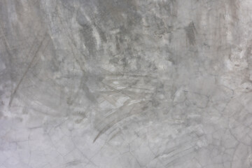 Front view of old vintage, grunge and natural white-grey stucco wall shows beautiful texture surface of natural cracks and stains concrete structure. It is retro and vintage decoration for background.