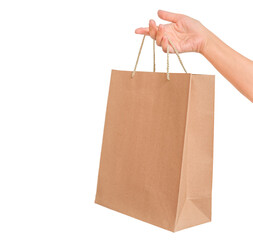 Cardboard shopping bag in female hand isolated