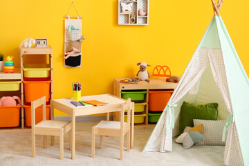Stylish interior of modern children's room with play tent
