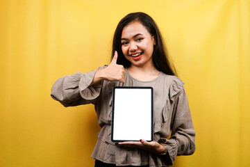 Beautiful young woman hands holding tablet with blank or white screen, presenting something, promoting product, cheerful and confident, advertisement, isolated