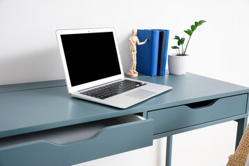 Fototapeta premium Stylish workplace near wall in room