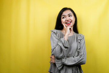 Beautiful young woman, looking at empty space, presenting something, isolated