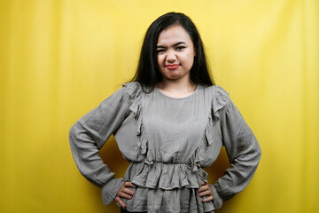 Beautiful young woman with angry expression, serious, isolated