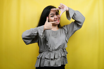 Beautiful young woman with camera portrait gesture, isolated