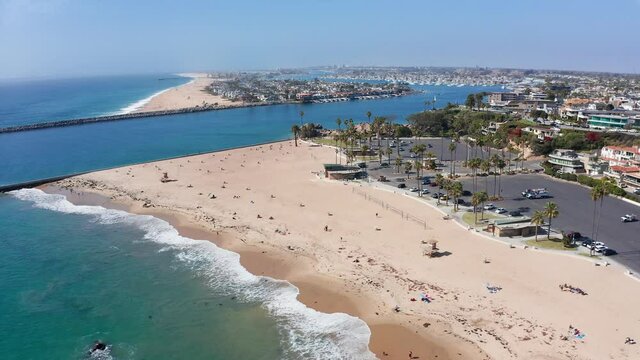 aerial panoramic over Newport beach, California. Bay channel entrance to the harbor