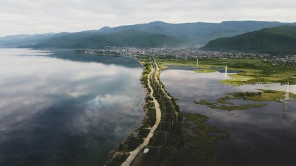 Railway in the lake, mountains