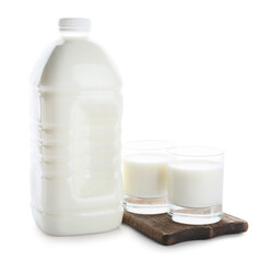 Gallon bottle and glasses of milk on white background