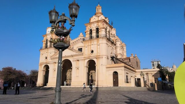 Low level walk through shot, between street lamp and block letter sign, A MO CBA, I LOVE CORDOBA toward famous Cathedral of Cordoba, Our Lady of the Assumption at San Martin Plaza.