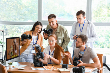Professional photographer teaching young people in studio