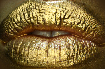 Glossy luxury mouth. Golden make up. Colorful sexy lips, golden art. Gold bright make-up in lips.