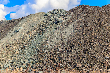 View of slag heaps of iron ore quarry. Mining industry