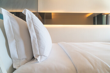 Fototapeta na wymiar white comfortable pillows decoration on bed